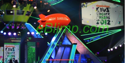 Adam sandler winner at nickelodean kids choice awards orange blimp on live tv.